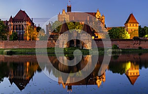 Illuminated walls of the Malbork Castle at night