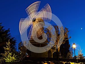 Illuminated windmill romantic night scenery festive season