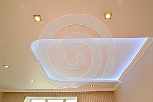 Illumination of the central design on an opaque stretch ceiling