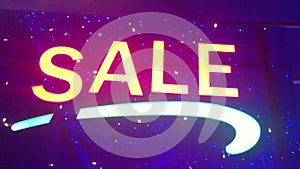 Illumination Sale. Street sign with small lights, garlands. Scenery with glowing, flashing lights. Dynamic, motion footage. Holid