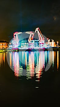 Illuminations in the Polish city of Szczecin, ferris wheel, port grider,  at night Europa