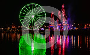 Illuminations in the Polish city of Szczecin, ferris wheel, port grider,  at night Europa