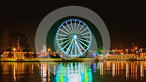 Illuminations in the Polish city of Szczecin, ferris wheel, port grider,  at night Europa