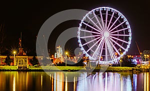 Illuminations in the Polish city of Szczecin, ferris wheel, port grider,  at night Europa