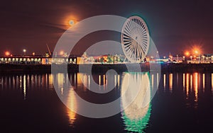 Illuminations in the Polish city of Szczecin, ferris wheel, port grider,  at night Europa