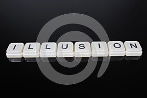 Illusion text word title caption label cover backdrop background. Alphabet letter toy blocks on black reflective background. White