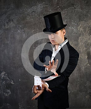 Illusionist man with cards fan