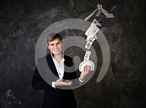 Illusionist man with fountain of cards