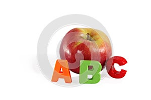 Illustrated alphabet letter A and apple.