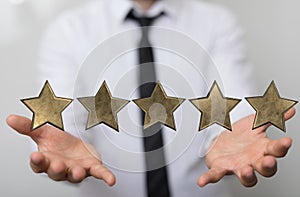 Illustration of 5 stars over a person's hand
