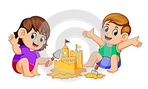 Boy and girl making a big sandcastle at beach