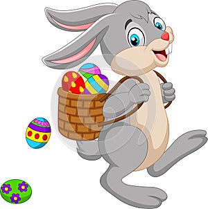 Cartoon Easter Bunny carrying basket of an Easter egg photo