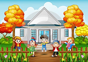 Cartoon happy children in front house with tree autumn