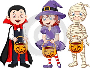 Cartoon kids with halloween costume holding pumpkin basket photo