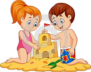 Children making sand castle at tropical beach