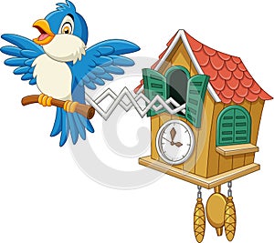 Cuckoo clock with blue bird chirping photo