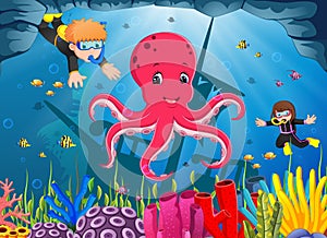 Cute octopus under the sea with boy and girl diving