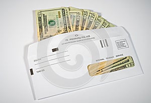 Illustration of the federal stimulus payment from the IRS paid in cash on white photo