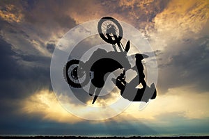 Freestyle motorcross at sunset photo