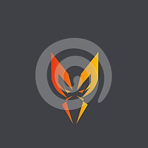 An illustration of a geometric logo that forms an orange face on a black background