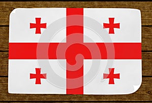 Illustration of a Georgian flag painted on the papier pasted on