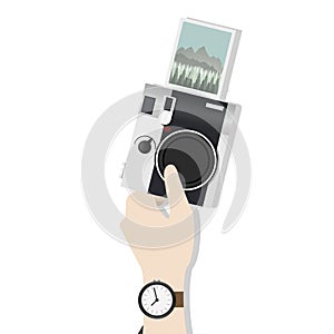 Illustration of hand holding digital camera with photograph clicked photo