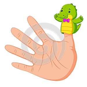 Hand wearing a crocodile finger puppet on thumb