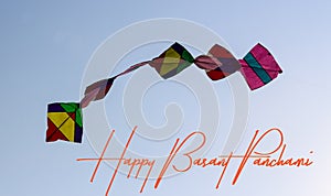 Illustration of Happy Basant Panchami colourful kites in the sky photo