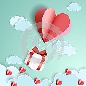 Illustration of love, the heart shape of a balloon cut out of paper, flying with a gift box into the sky. Handmade crafts.