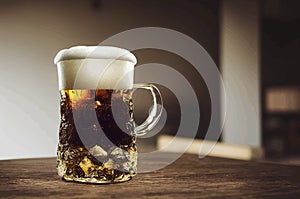 illustration of a mug of cold beer on a wooden table