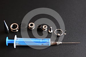 Illustration piercing addiction .non-ordinary hobbies of people who love punctures in their bodies. syringe accessories piercing