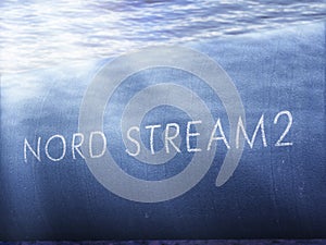 Illustration with a pipe and the inscription `Nord Stream 2` on it