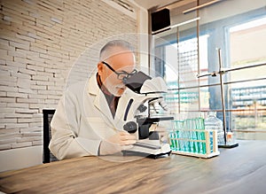 Illustration of scientist in a lab coat examines a sample under a microscope amidst various lab equipment. A scene of scientific