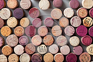 A seamless pattern of wine corkage, arranged in an artistic display on the wall, showcasing different colors and textures. th photo