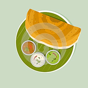 South Indian breakfast dish `Dosa with Sambar and Chutney` on banana leaf