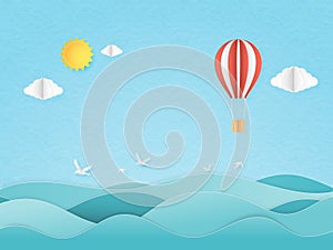 Illustration of travel in a vacation time. Origami made red and white hot air balloon flying over seascape with sun and cloud,