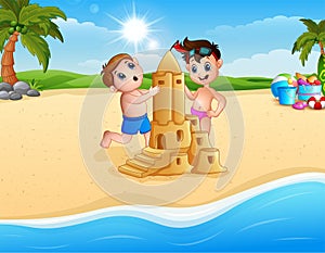 Two boy making sand castle at the beach