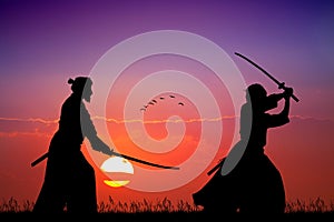 Two Samurai with sword at sunset