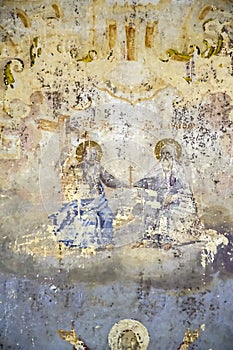 Illustrations from the bible on the wall of an abandoned temple