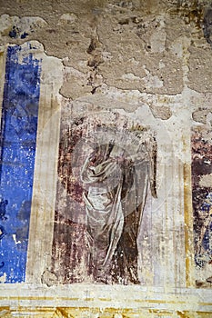 Illustrations from the bible on the wall of an abandoned temple