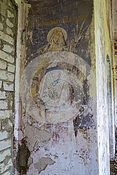 Illustrations from the bible on the wall of an abandoned temple