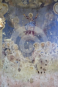 Illustrations from the bible on the wall of an abandoned temple