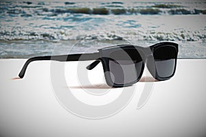 Illustrations that convey the meaning of good summer travel with images of sunglasses and beach.