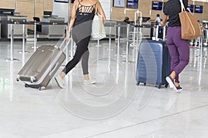 Illustrative editorial image. Airport luggage Trolley with suitcases, unidentified man woman walking in the airport, station, Fran