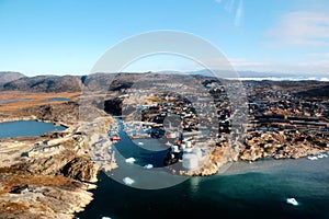 Ilulissat city from a aerial view in Greenland, with fjord of jakobshavn and iceberg