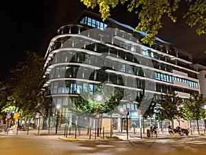 Iluminated modern building night scene Boulogne Billancourt, France photo