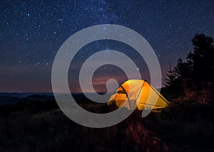 Iluminated tent under stars