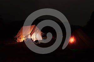 Iluuminated from inside, trekkers camp at Varsey Rhododendron Sanctuary or Barsey Rhododendron Sanctuary, at night, Singalila photo