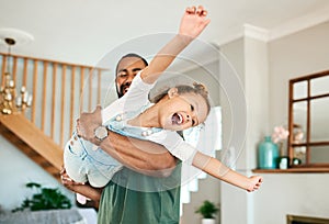 Im a bird. a father and his little daughter having fun together at home.