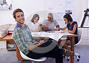 Im definitely in the right profession. Portrait of a handsome male architect with his colleagues working in the